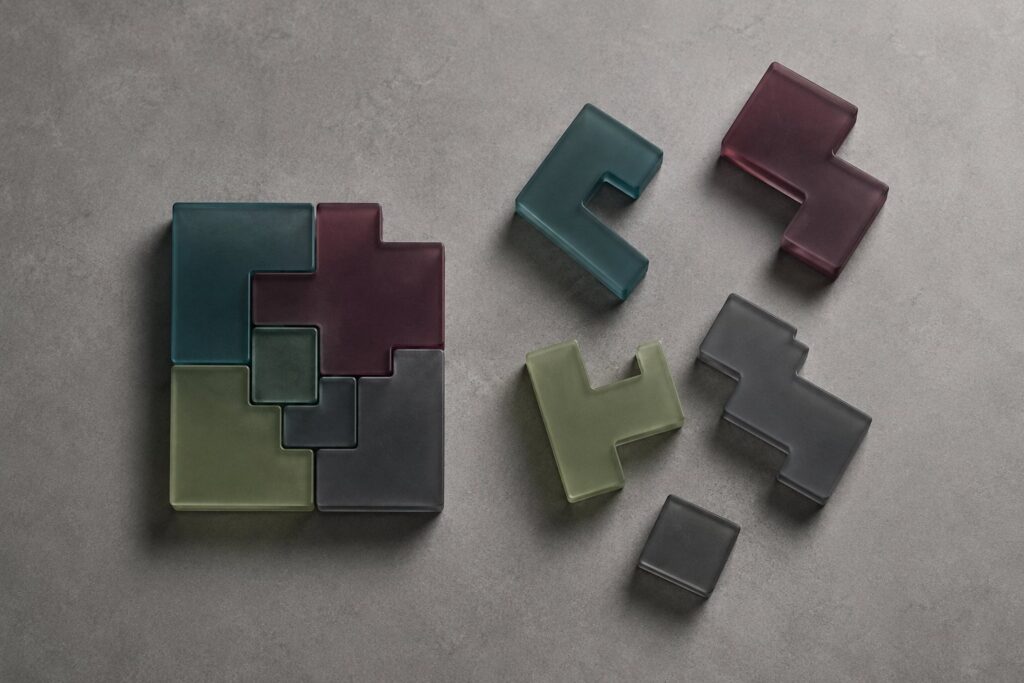 Overhead view of interlocking modular blocks assembling into a working shape, illustrating how AI skills snap capabilities together on demand.